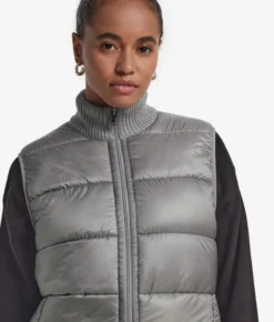 Piumino smanicato reversibile in bouclé